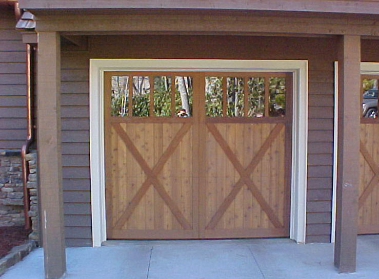 Another example of That Architect Architect's decorative treatments to garage doors.  All of The Architect's garage doors are motorized and are operated from your vehicle's remote control button, and roll upward to the garage ceiling.  The appearance that these doors are side hinged from a previous historic era are simply the result of the architect's design.