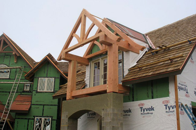Mountain home architect That Architect designed this estate home in Western North Carolina, now under construction.  Here, you can see the timber frame for an upper level porch being installed.  (C)Copyright 2007-2010 That Architect, All Rights Reserved Worldwide. photo courtesy of Koenig Homebuilders.